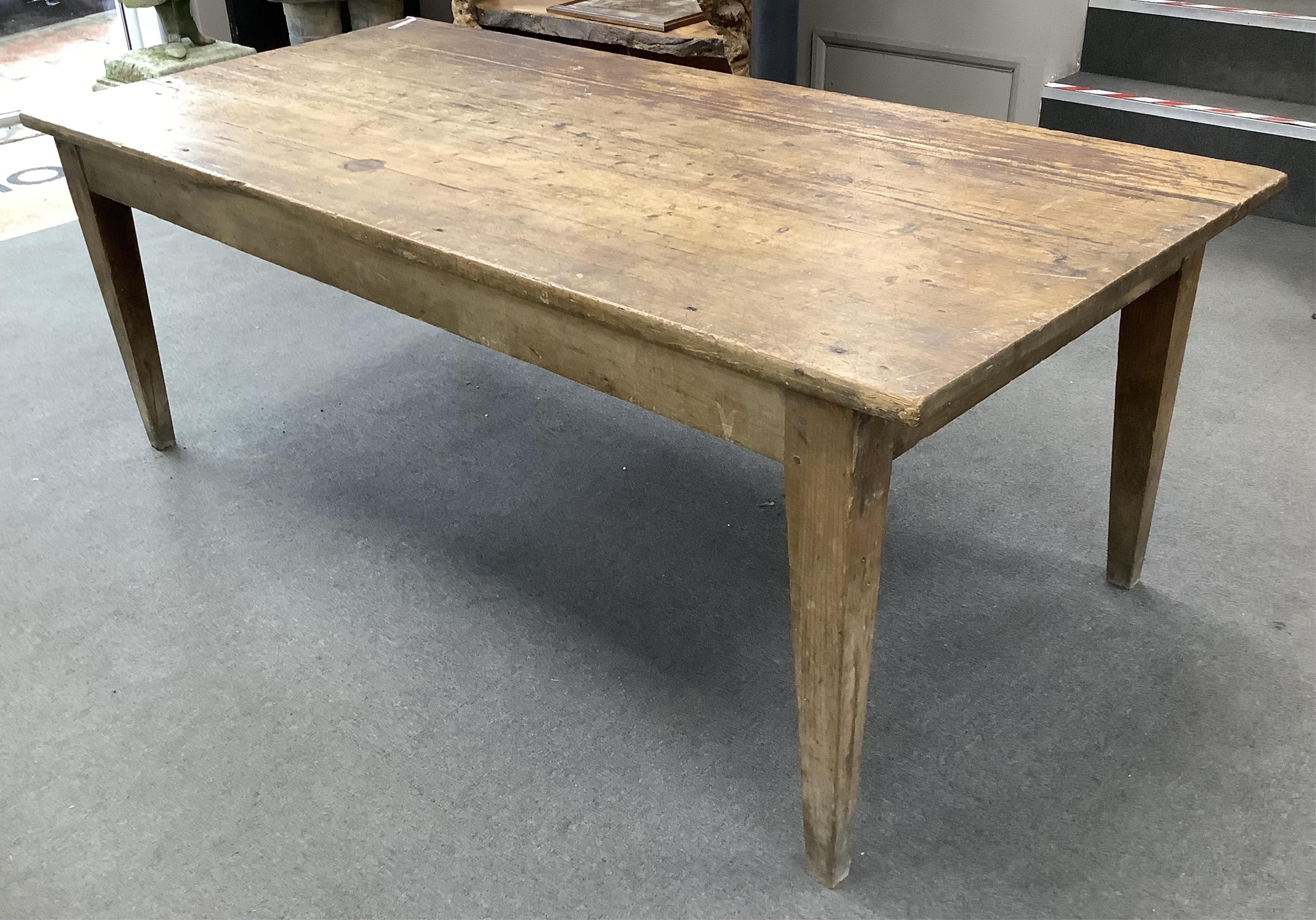 A 19th century French rectangular oak and pine kitchen table, width 198cm, depth 94cm, height 72cm. Condition - fair